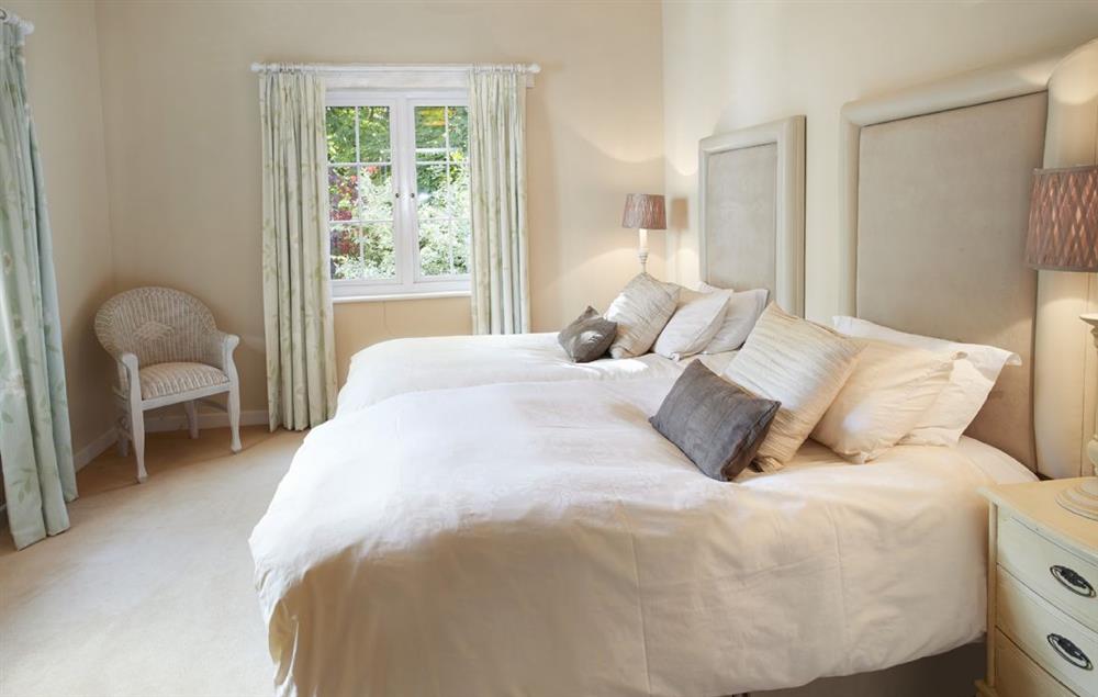 Large twin bedroom with 3’6 beds at St Corantyn Cottage, Helston