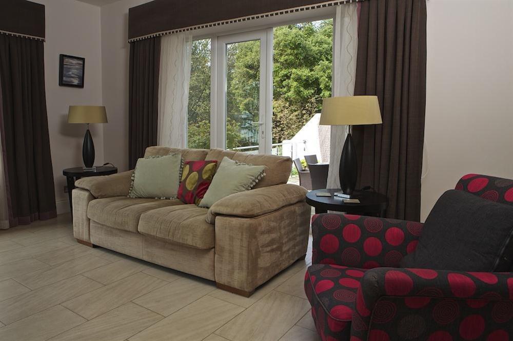 Lounge leading to decked patio (photo 2) at St Elmo Lodge in Sandhills Road, Salcombe