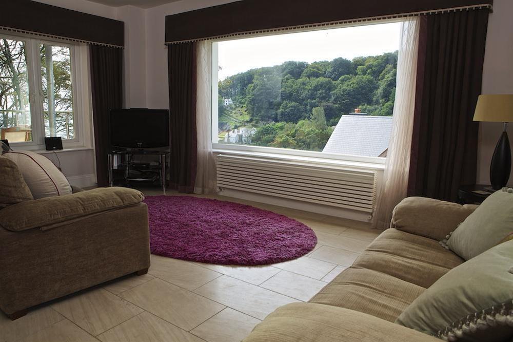 Lounge leading to decked patio at St Elmo Lodge in Sandhills Road, Salcombe
