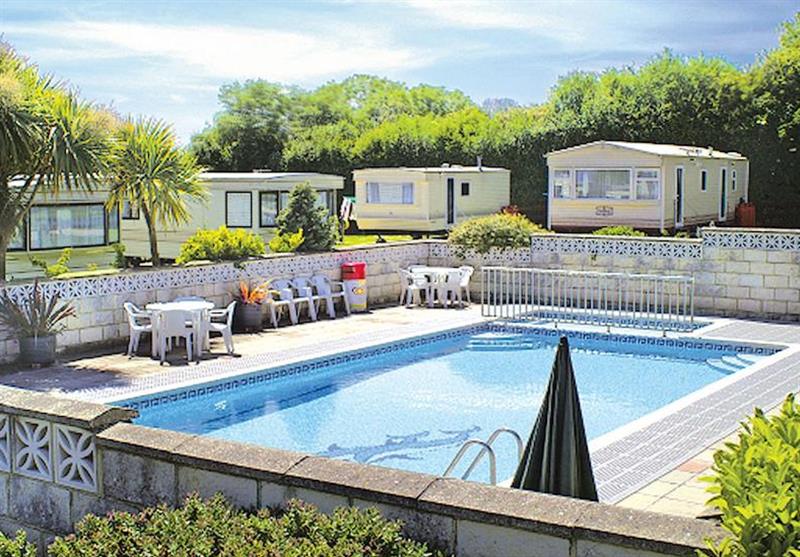 Outdoor heated swimming pool at St Helens Holiday Park in Isle of Wight, South of England