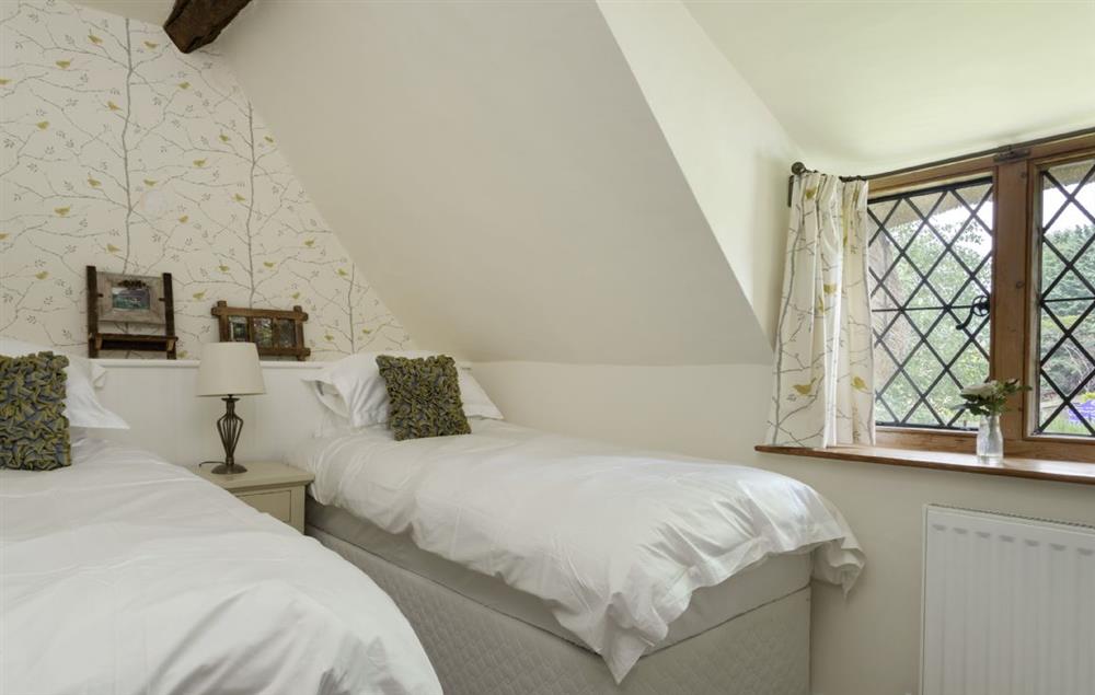 First floor: Twin bedroom with two 3' single beds at St Michaels Cottage, Broadway
