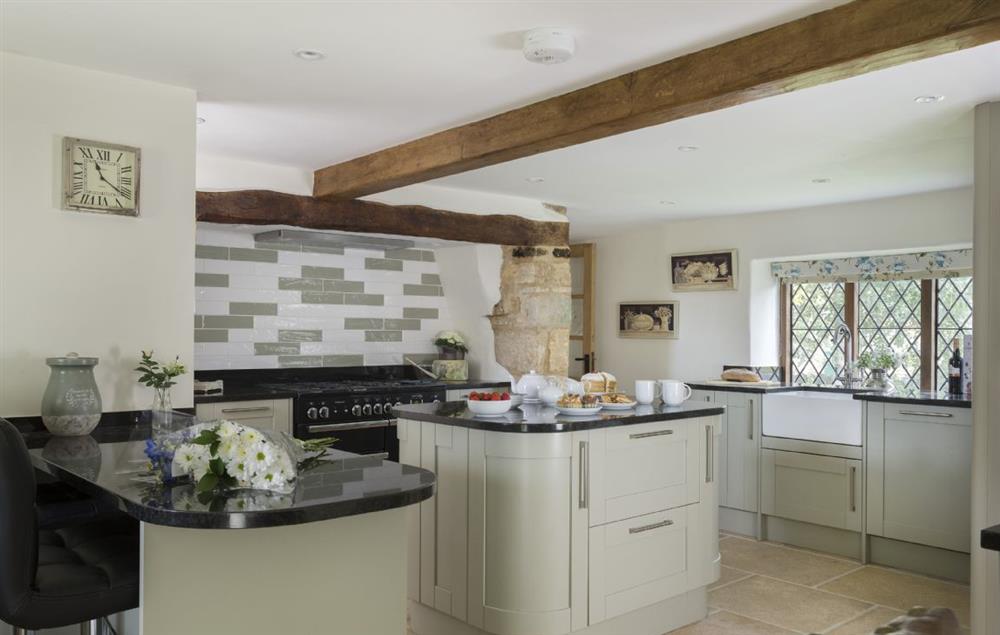 Ground floor: Kitchen with island and breakfast bar allowing for sociable cooking and entertaining (photo 2) at St Michaels Cottage, Broadway