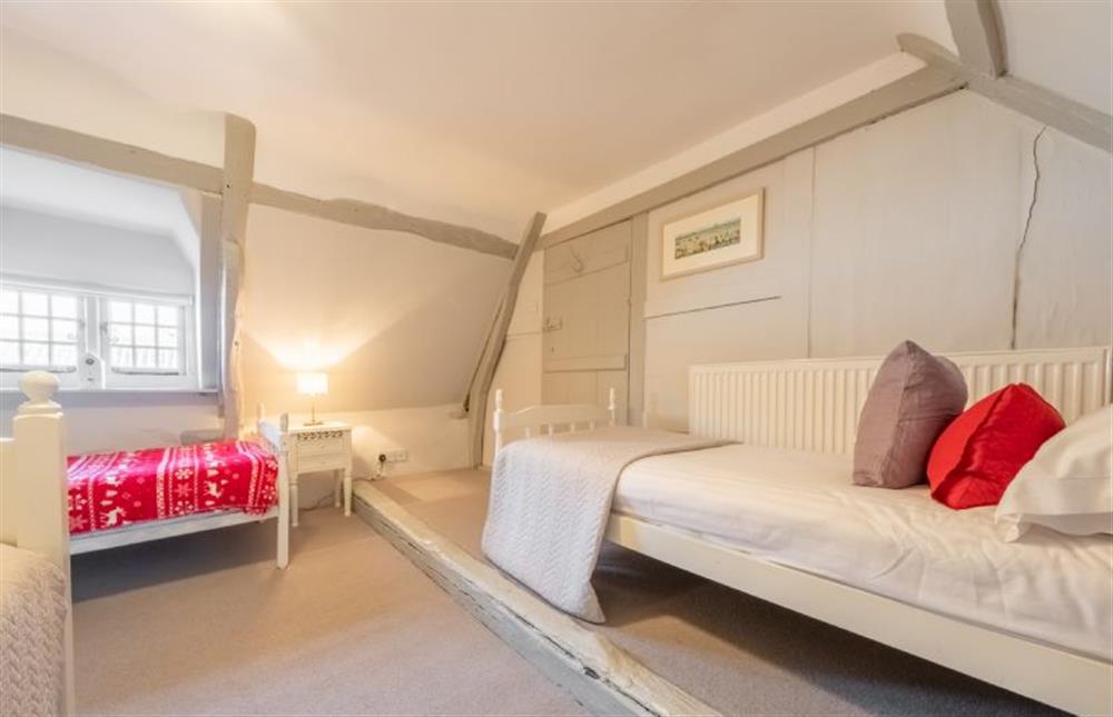 Second floor: Bedroom four with three single beds (photo 2) at St Michaels Cottage, Wells-next-the-Sea
