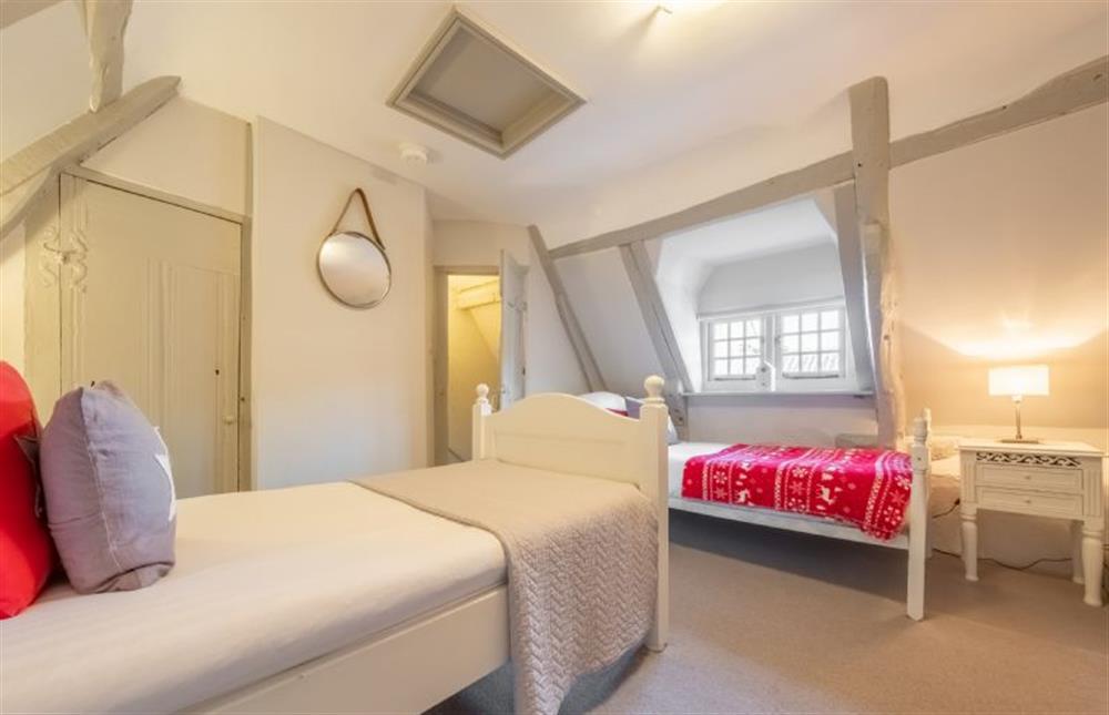 Second floor: Bedroom four with three single beds (photo 4) at St Michaels Cottage, Wells-next-the-Sea