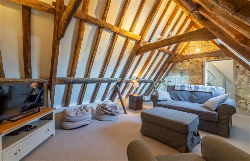 Third floor: TV room/fifth bedroom with sofa bed  at St Michaels Cottage, Wells-next-the-Sea