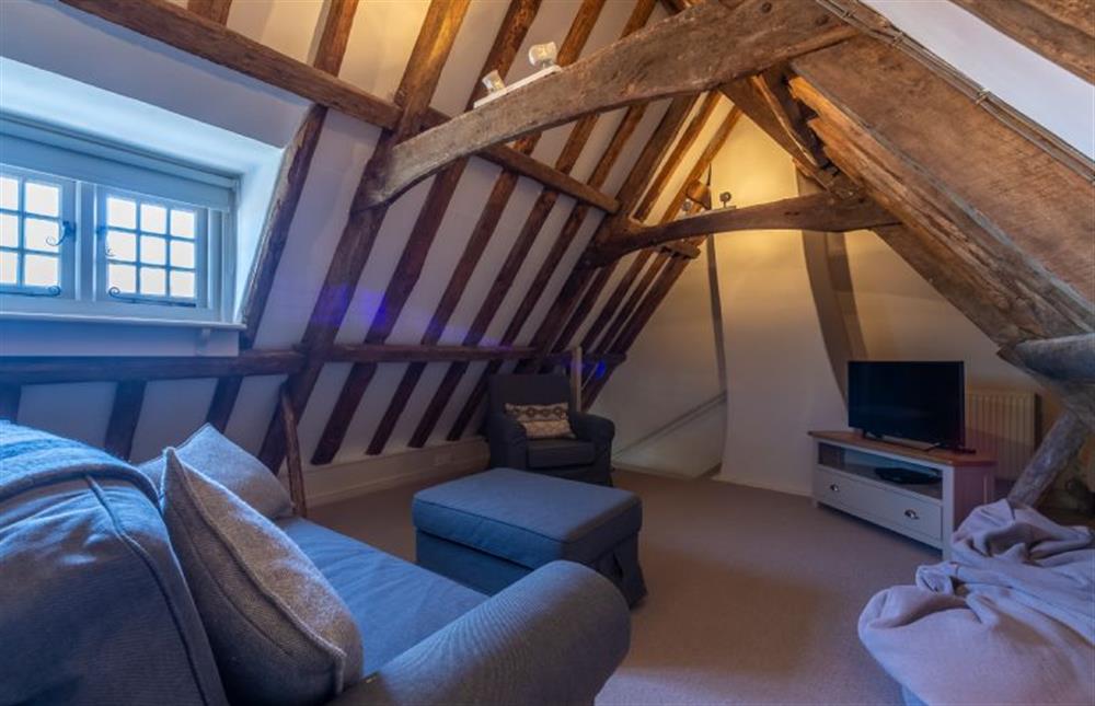 Third floor: TV room/fifth bedroom with sofa bed at St Michaels Cottage, Wells-next-the-Sea