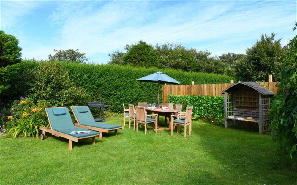 The private garden is fully enclosed for dogs and small children. Plenty of options for enjoying the garden in the sunshine! at St Michaels Farmhouse in Penzance