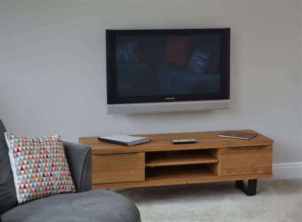 The living area has a large, flat screen TV with DVD player at St Monicas in Fowey, Cornwall