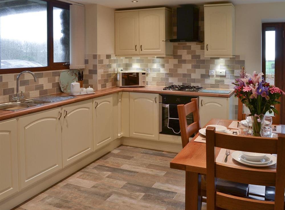 Well equipped kitchen & dining area (photo 2) at Stabal Arthur in Bodedern near Holyhead, Gwynedd