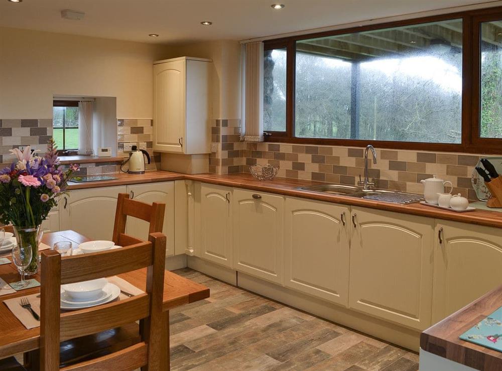 Well equipped kitchen & dining area at Stabal Arthur in Bodedern near Holyhead, Gwynedd