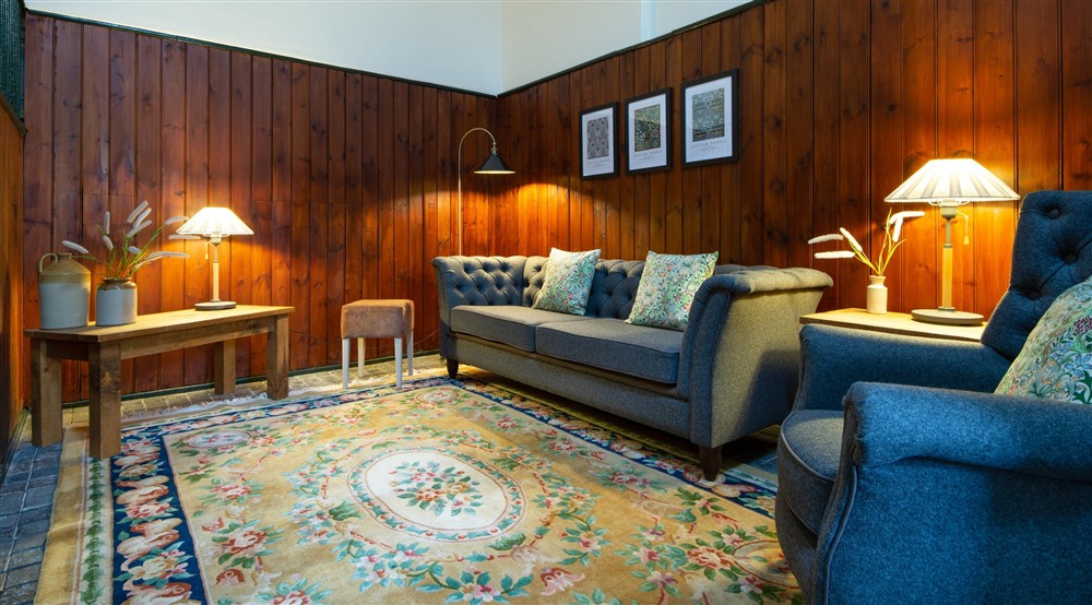 The sitting and dining room (photo 3) at Stabl Bach in Caernarfon, Gwynedd