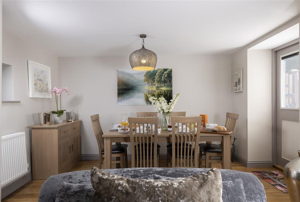 Ground floor: Open-plan living space combining the dining area and sitting room at Stable Barn, Little Rissington