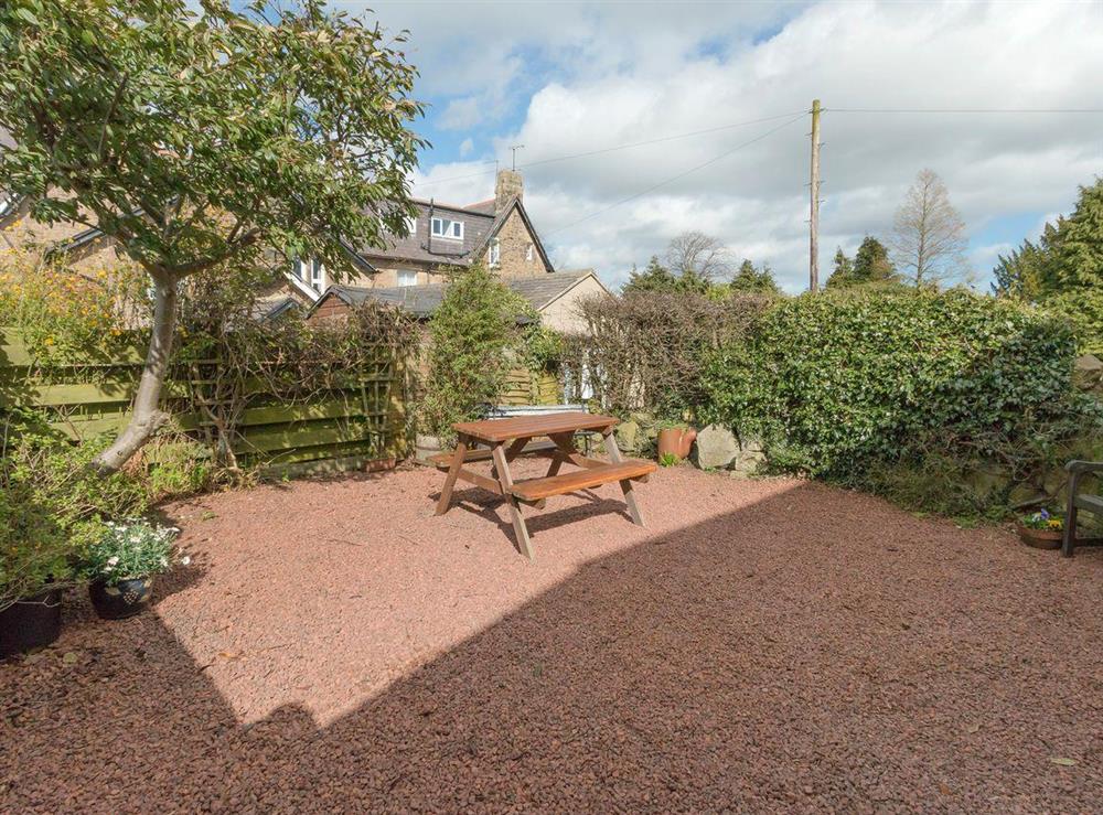 Enclosed gravelled patio with outdoor furniture at Stable Cottage in Alnwick, Northumberland