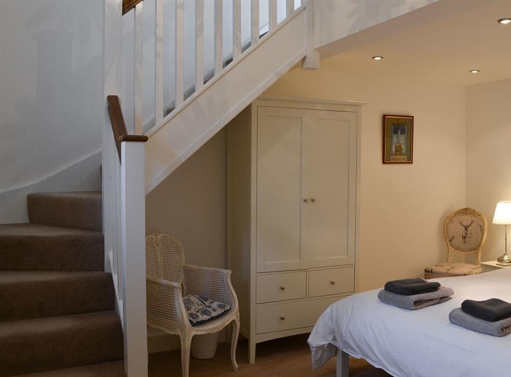Double bedroom with stairs to en-suite at Stable Cottage in Chatton, near Wooler, Northumberland