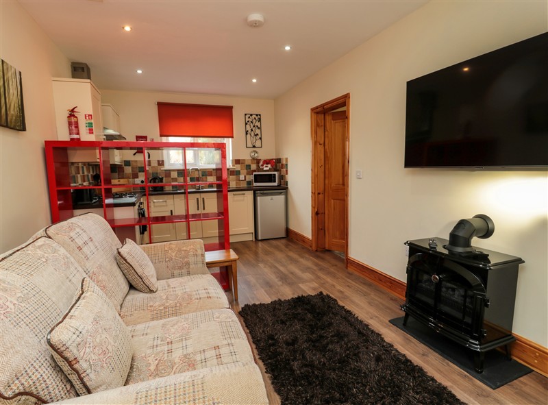 Relax in the living area at Stable Cottage, Cottonshopeburnfoot near Otterburn
