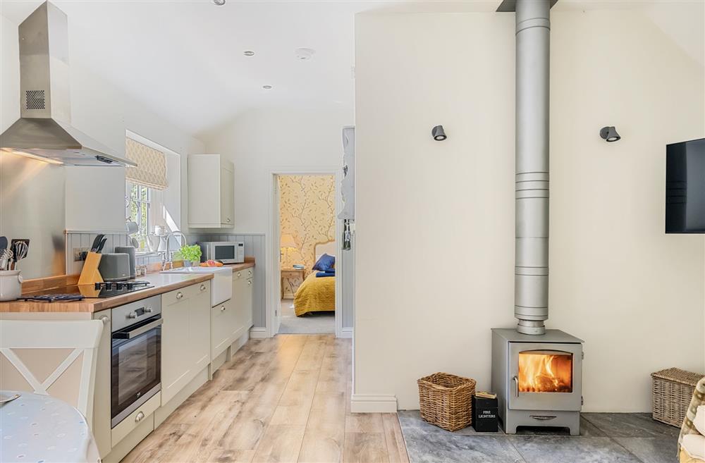 The wood burning stove is ideal for cosy days in at Stable Cottage, Dorchester