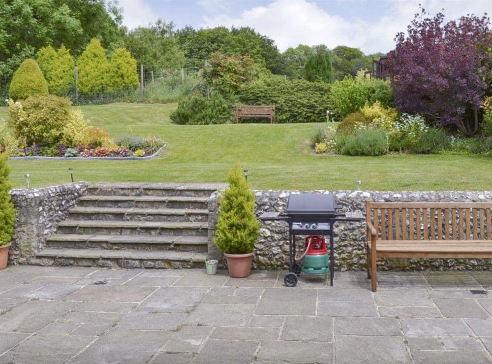 Paved patio area and well-maintained garden at Stable Cottage in East Meon, Petersfield, Hants., Hampshire