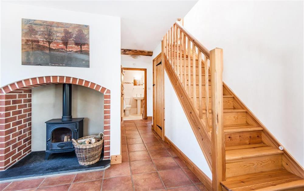 Snuggle up in front of the woodburner. at Stable Cottage in Honiton