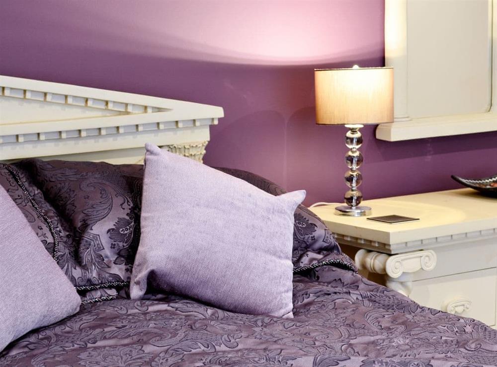 Characterful bed area at Stable Cottage in Llandudno, Gwynedd
