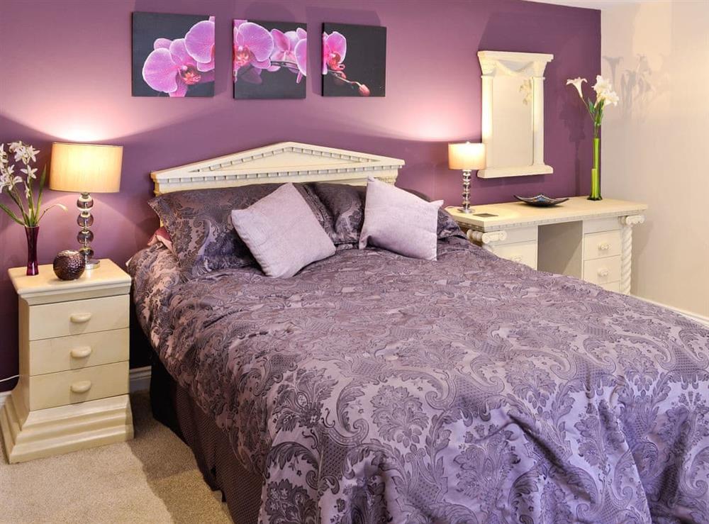 Double bed area at Stable Cottage in Llandudno, Gwynedd