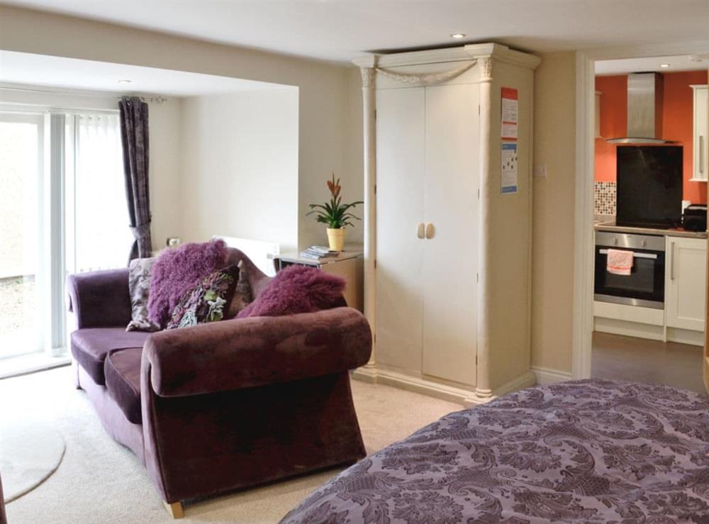 Double bed/ living area at Stable Cottage in Llandudno, Gwynedd