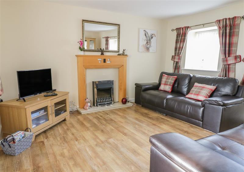Relax in the living area at Stable Cottage, Llanrhos near Llandudno Junction