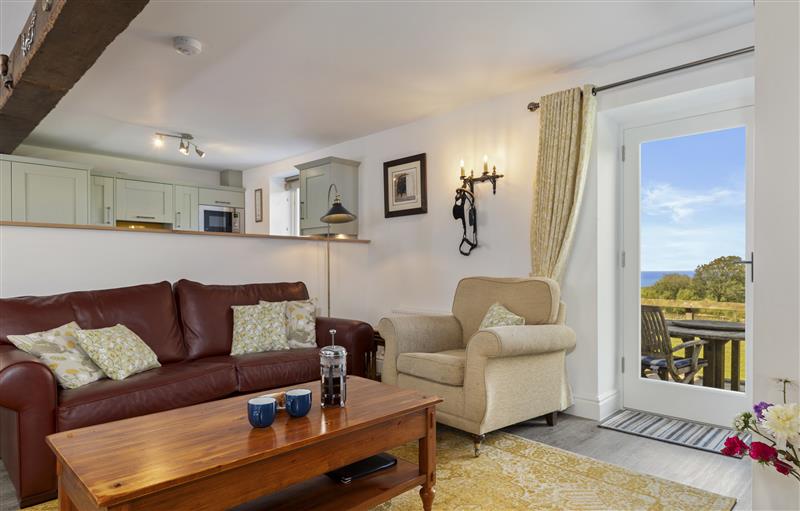 Relax in the living area at Stable Cottage, New Quay