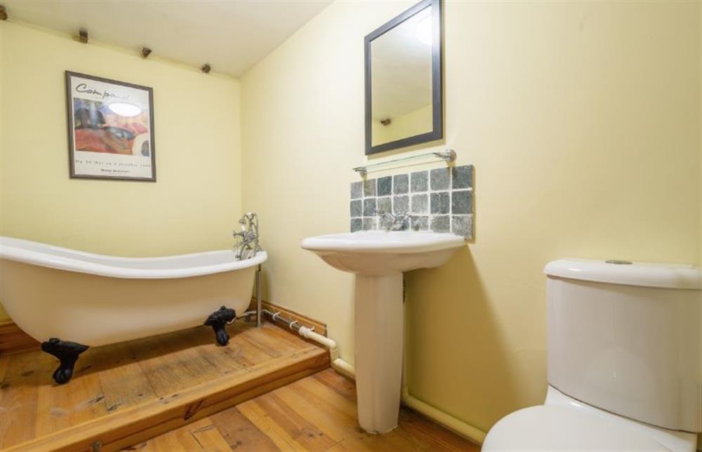 Bathroom with freestanding bath, wash basin and WC at Stable Cottage, Semer