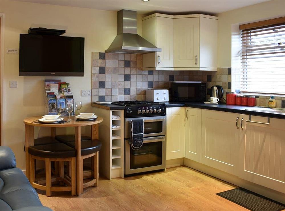 Dining area and well equipped kitchen at Stable Cottage in Thirsk, North Yorkshire