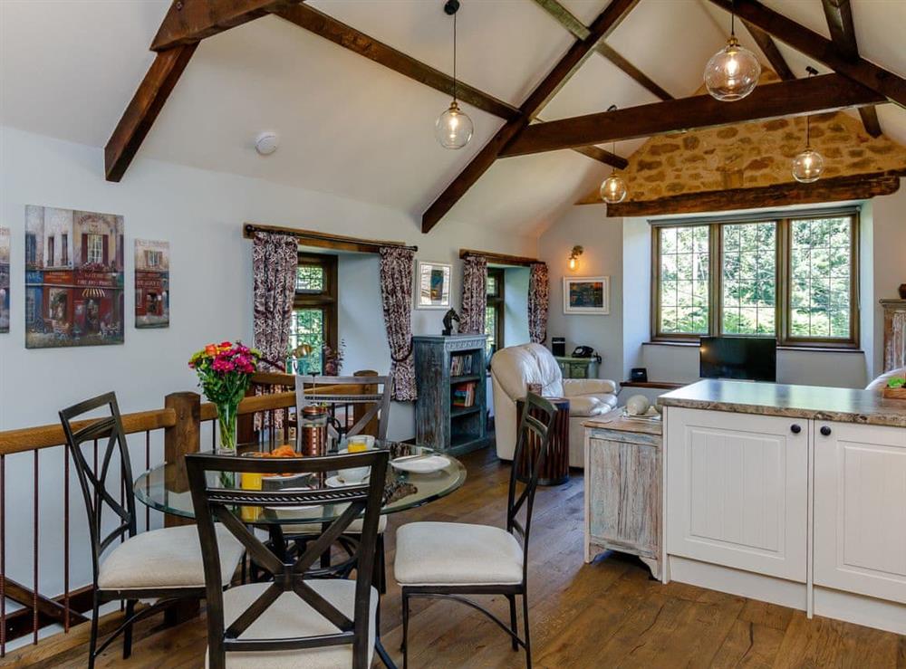 Exposed wooden beams throughout the living area at Stable Cottage in Uley, near Dursley, Gloucestershire