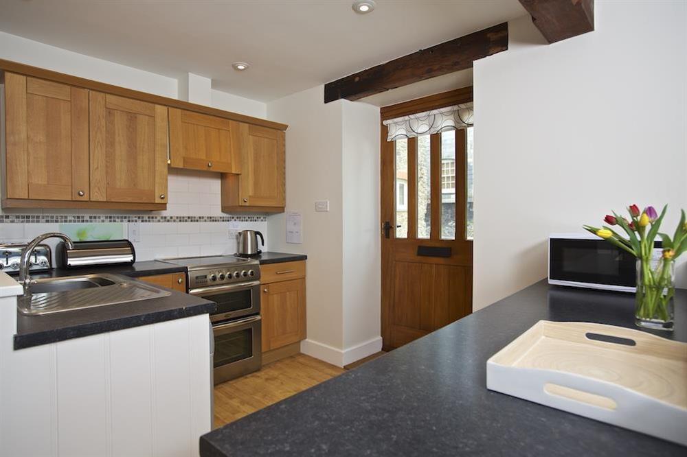 Fully fitted and stylish kitchen (photo 2) at Stable End Cottage in Malborough, Nr Salcombe