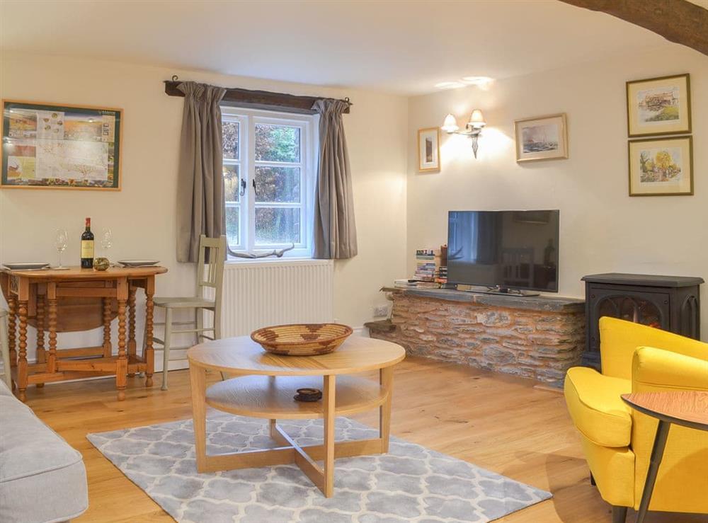 Cosy beamed living/dining areas at Stable End in Stickle Path, near Watchet, Somerset