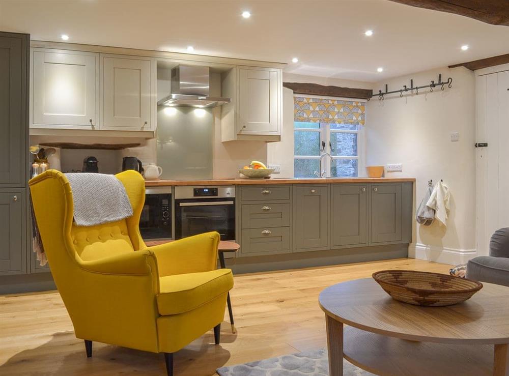 Sitting room and well appointed kitchen area at Stable End in Stickle Path, near Watchet, Somerset