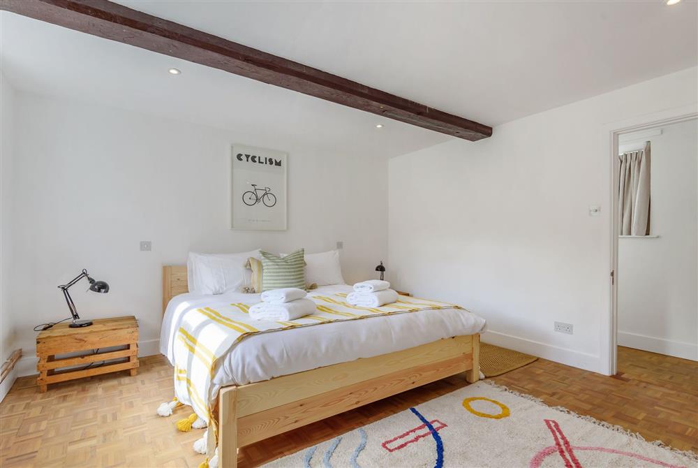 Bedroom three on the ground floor, with a 6’ super-king size bed  at Stable House, Clifton Maybank, nr Sherborne
