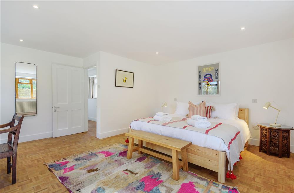 Bedroom two on the ground floor, with a 6’ super-king size bed at Stable House, Clifton Maybank, nr Sherborne