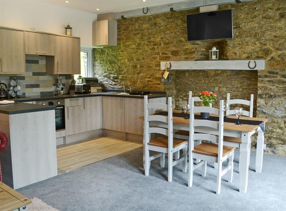 Stylishly furnished kitchen/dining area at Stable in Liskeard, Cornwall