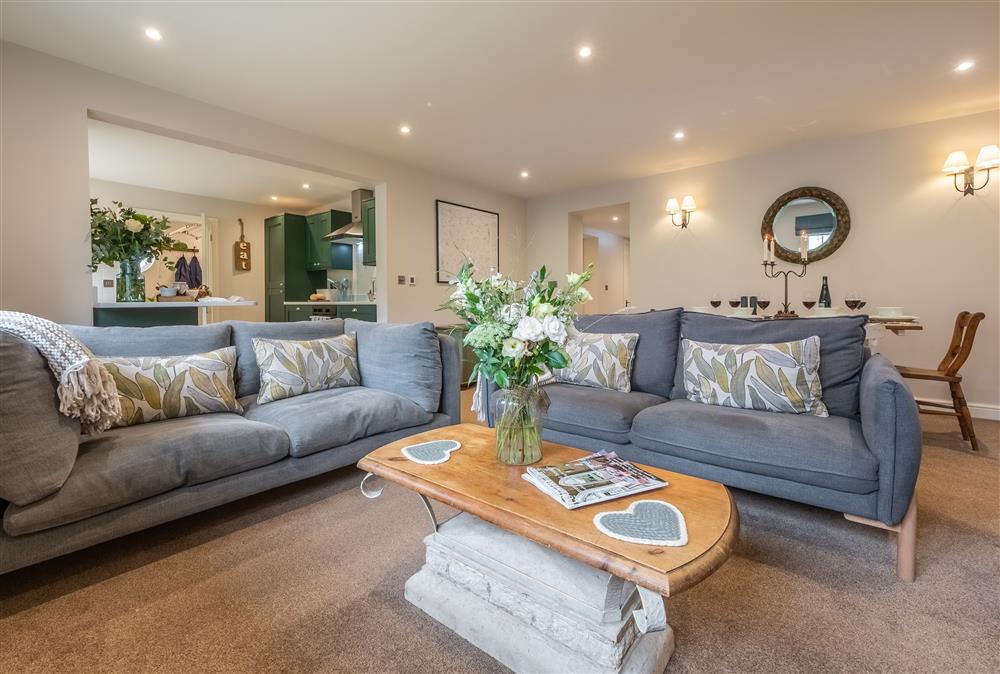 Open-plan dining and sitting area at Stables Cottage, Tilton On The Hill