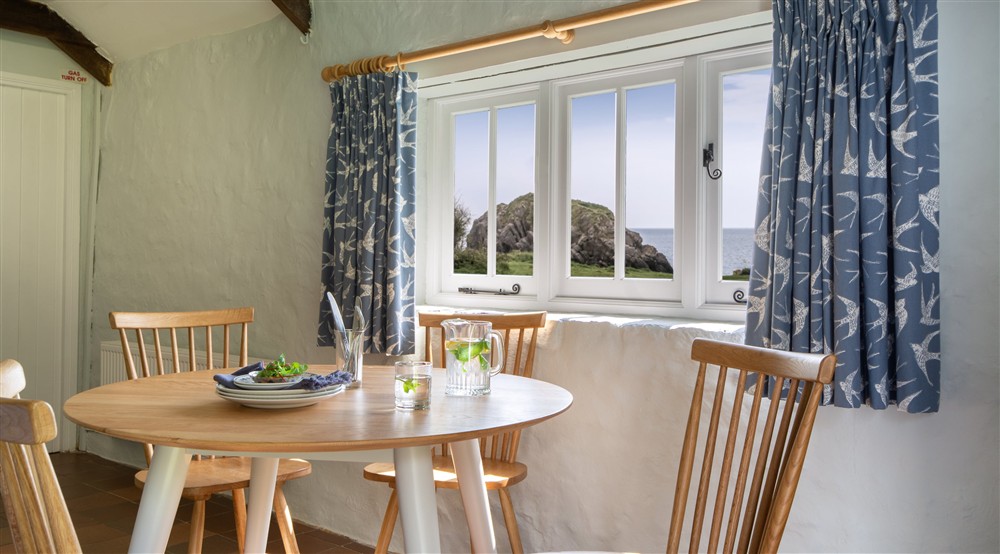 The dining area at Stackpole Byre 2 in Pembroke, Pembrokeshire