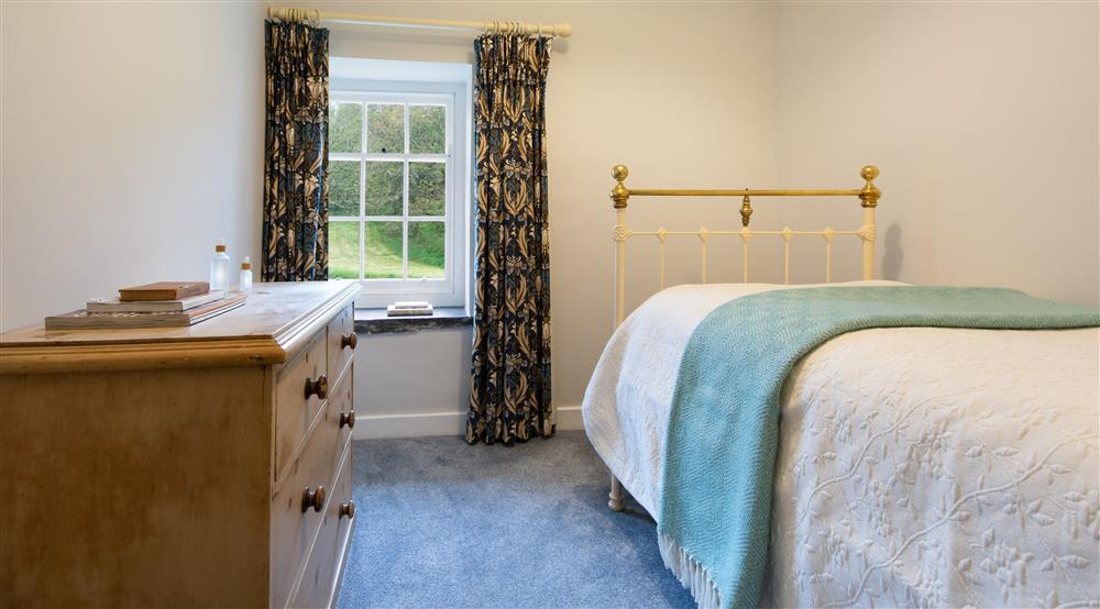 The single bedroom at Stackpole Cottage in Pembroke, Pembrokeshire