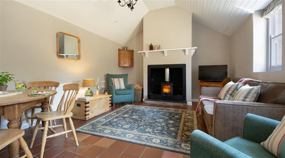 The sitting and dining room at Stackpole Dairy Cottage in Pembroke, Pembrokeshire