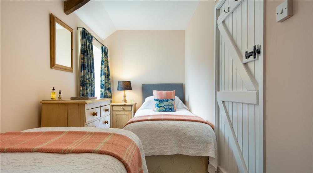 The twin bedroom at Stackpole Granary in Pembroke, Pembrokeshire