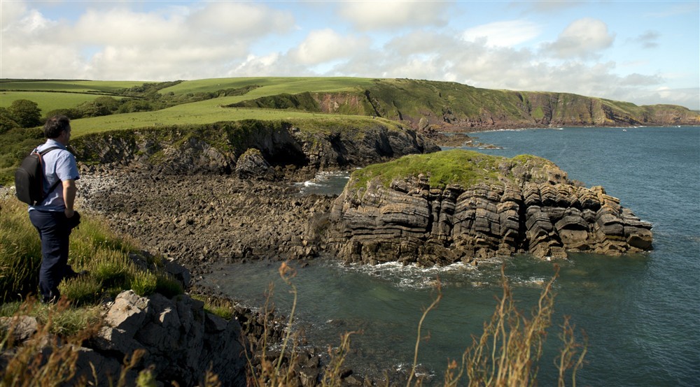 Visitor on the Pembrokeshire Coast Path at Stackpole Manor House in Pembroke, Pembrokeshire