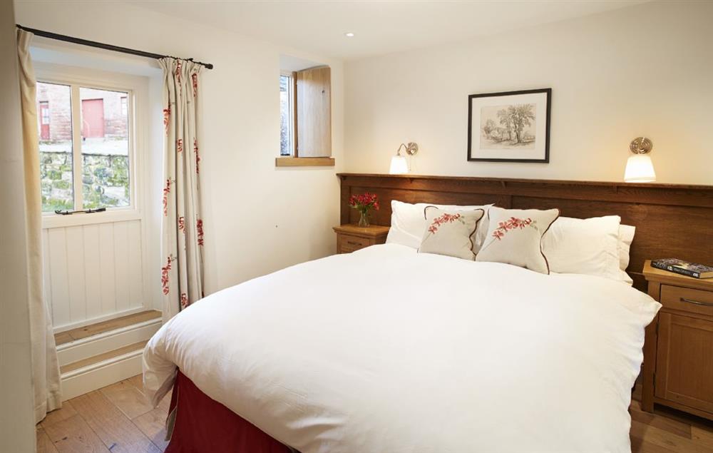 Double bedroom with 5’ zip & link bed which can be configured as twin beds upon request at Stag Cottage, Melmerby