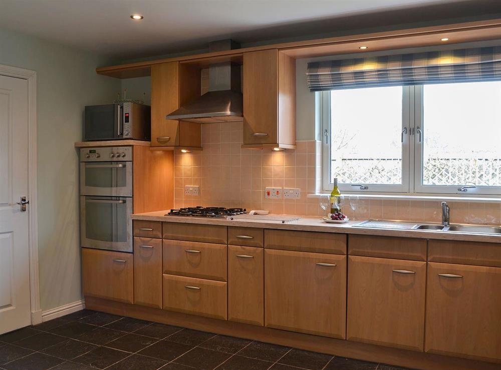Well equipped kitchen with tiled floor at Stags Neuk in Aviemore, Scottish Highlands, Inverness-Shire