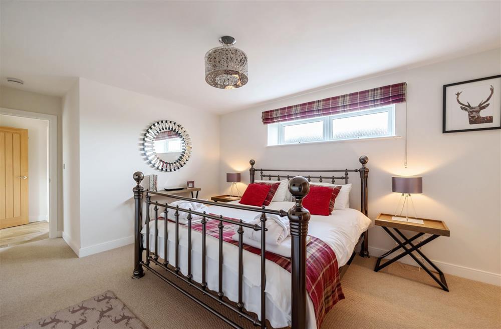 Bedroom one, with a 6’ super-king bed and Smart television at Stags Retreat, Sherborne