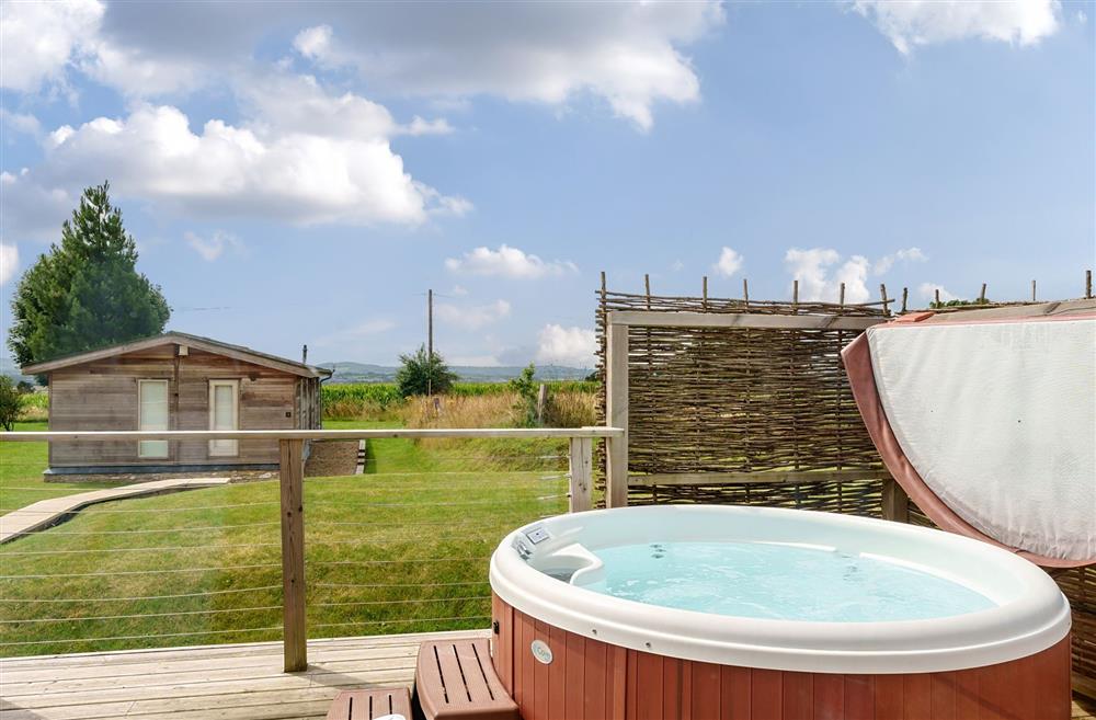 The hot tub on the sun deck, with glorious views at Stags Retreat, Sherborne