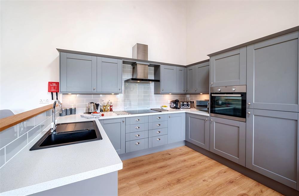 The well-equipped kitchen with integrated appliances at Stags Retreat, Sherborne