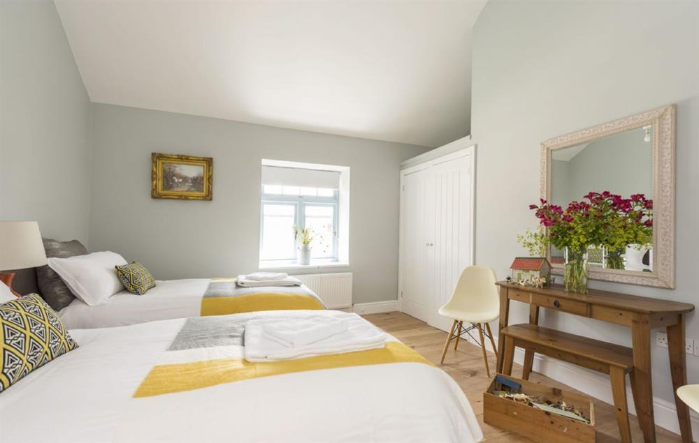 Ground floor bedroom four with twin beds at Stapleford Farm Cottages, Hooke