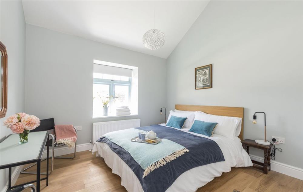 Ground floor bedroom one with a king-size bed and en-suite shower room at Stapleford Farm Cottages, Hooke