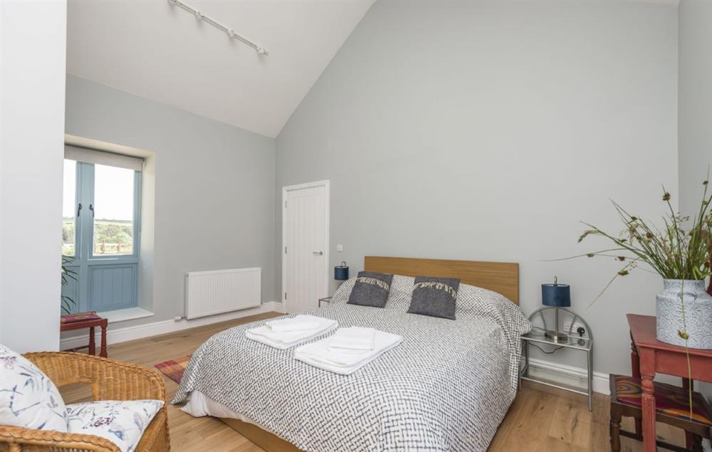 Ground floor bedroom one with king-size bed and en-suite at Stapleford Farm Cottages, Hooke